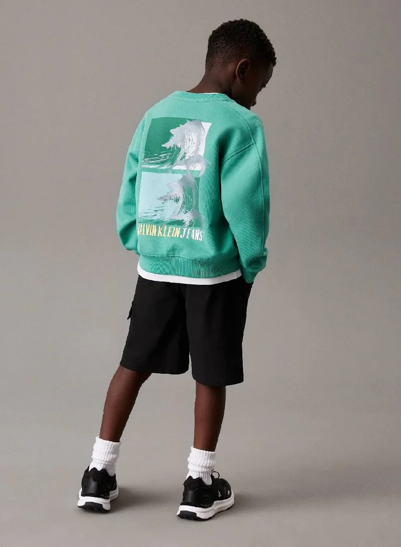 كالفن كلاين جينز سويت شيرت بقصة واسعة مزين برسومات خلفية