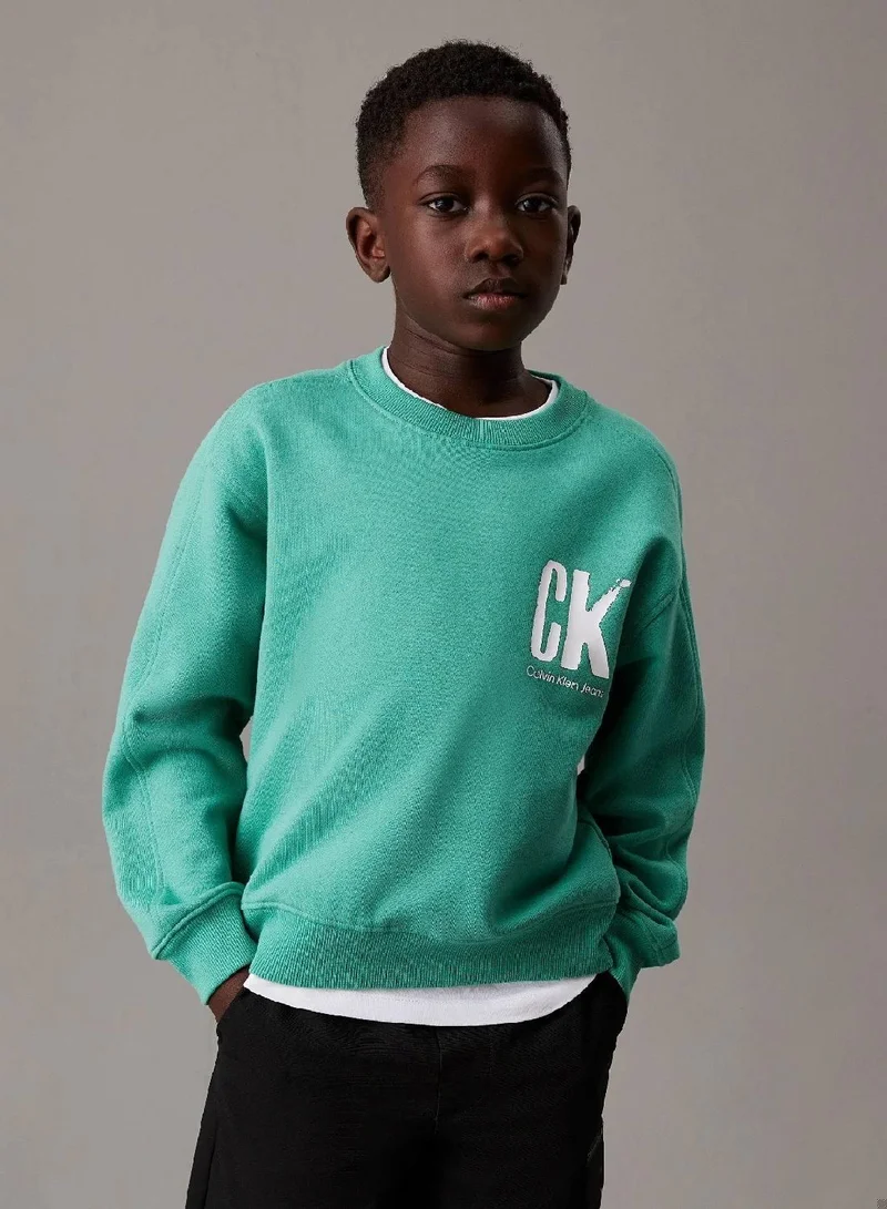 كالفن كلاين جينز سويت شيرت بقصة واسعة مزين برسومات خلفية