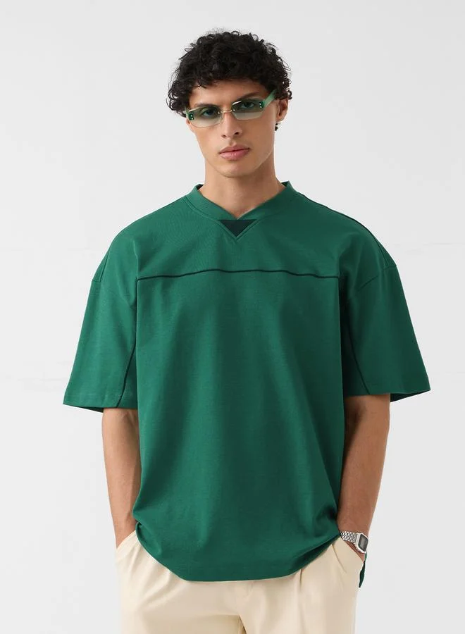 ذا سوليد ستور تيشيرت قطن بقصة واسعة