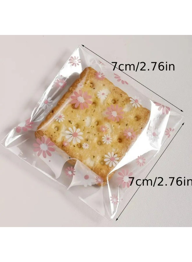 Kandid أكياس بسكويت زخرفية، 100 قطعة، تعبئة حلوى ذاتية اللصق، 7.01 سم مربع، تصميم ربطة بيضاء (زهرة وردية) - Image 2