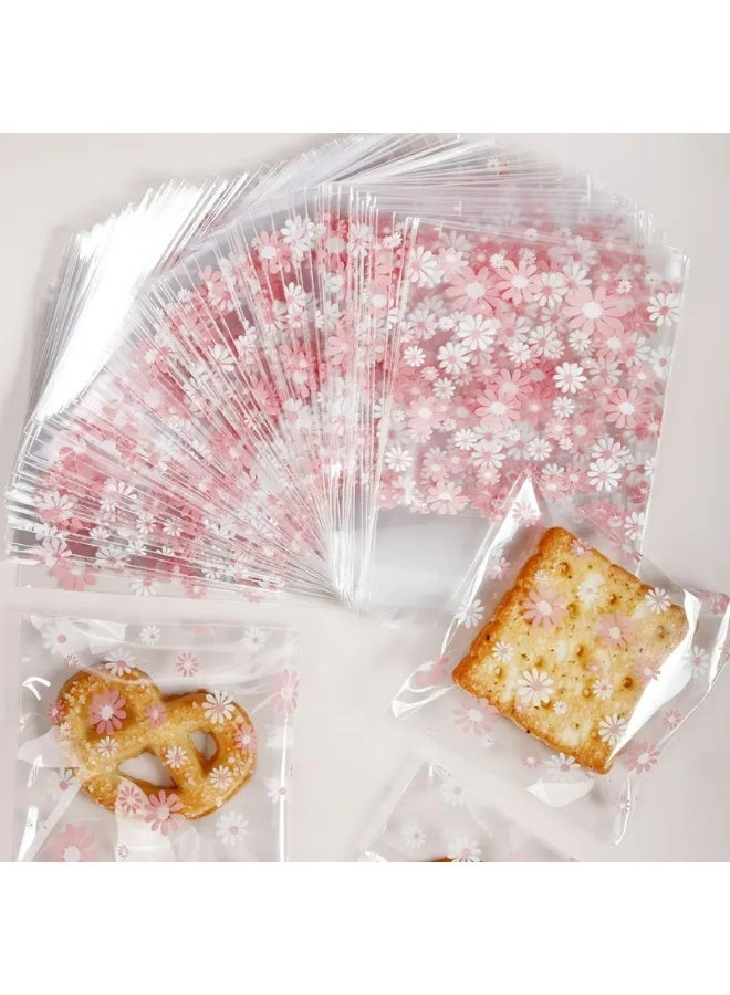 Kandid أكياس بسكويت زخرفية، 100 قطعة، تعبئة حلوى ذاتية اللصق، 7.01 سم مربع، تصميم ربطة بيضاء (زهرة وردية) - Image 1