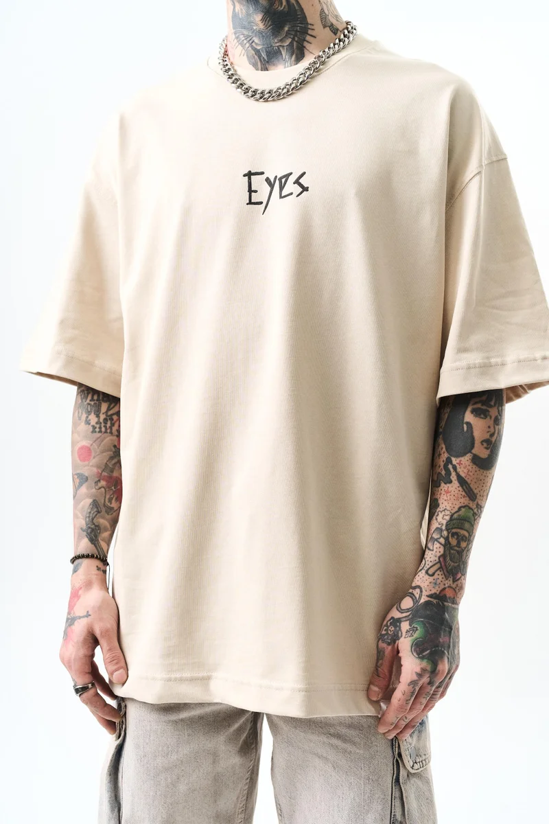 ريسباير تي شيرت رجالي مقاس كبير (Oversize) بطبعة "Eyes"، بيج