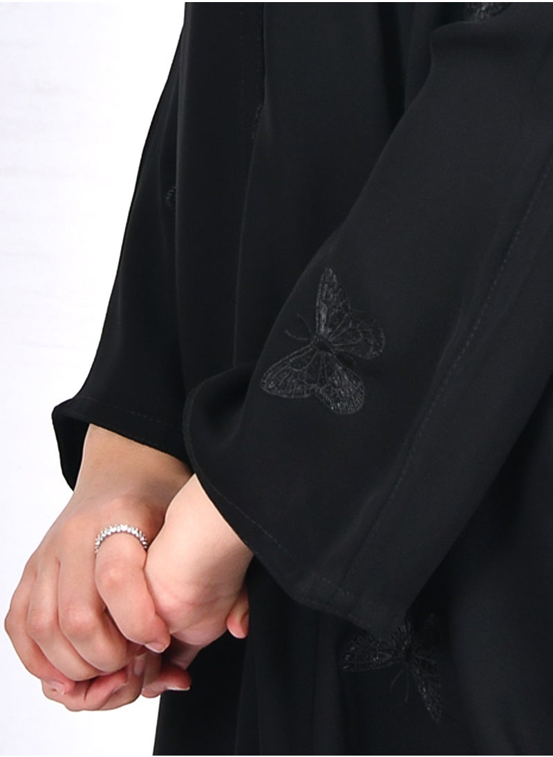 HAWRAA ABAYA - Girls' abaya with a bisht cut and embroidered with scattered butterflies in black - Image 1