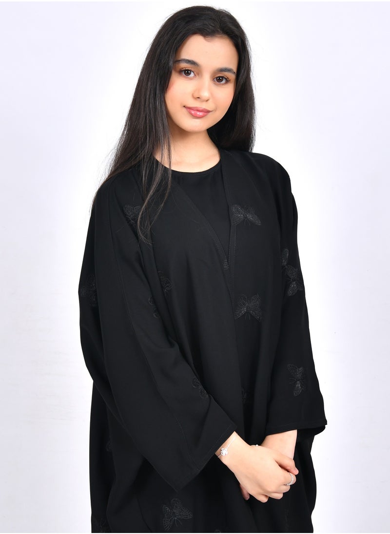 HAWRAA ABAYA - Girls' abaya with a bisht cut and embroidered with scattered butterflies in black - Image 1