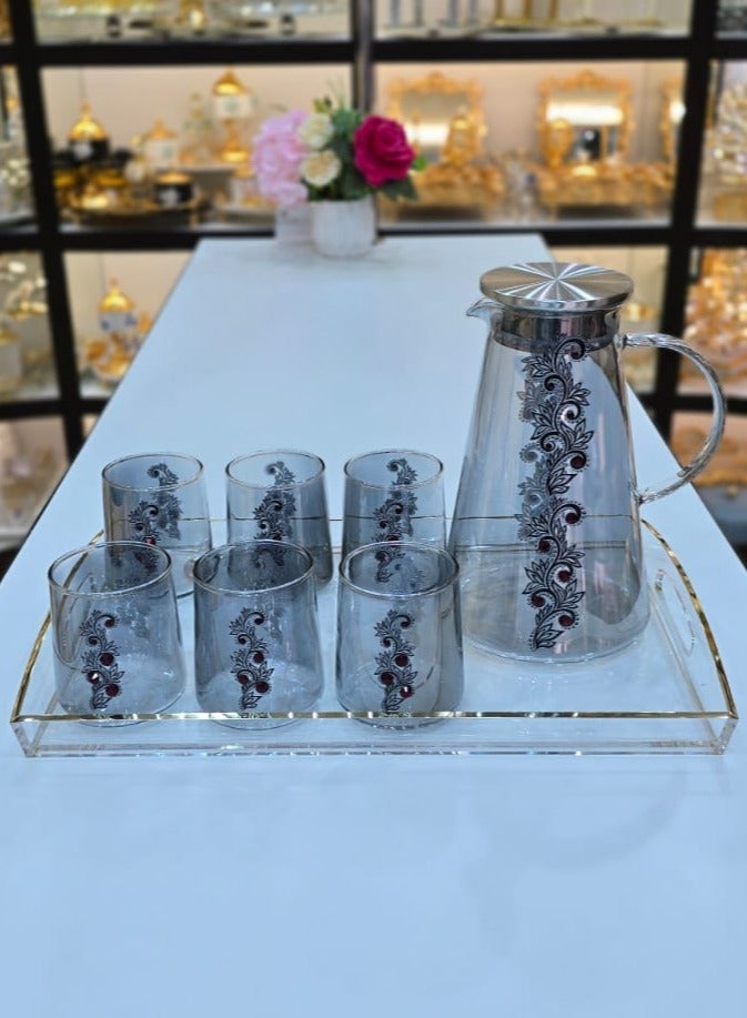 Damanhoor Stylish Glass Pitcher Set With Six Matching Tumblers Perfect For Serving Beverages Sleek Design With A Metal Lid And Handle Ideal For Modern Dining Setting - Image 1