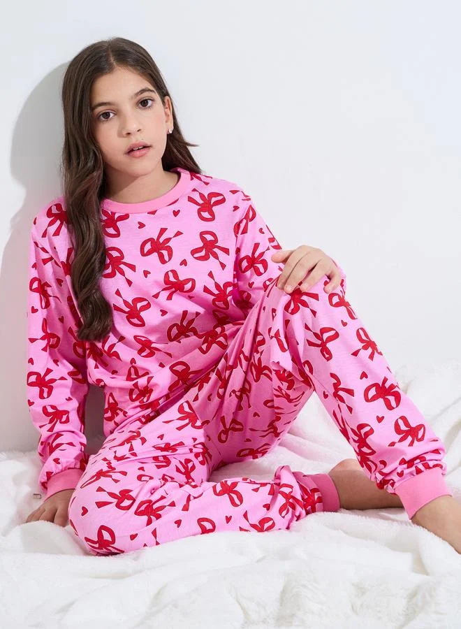 Styli Teen Girls All Over Bow Print Sweatshirt and Cuffed Pants Pyjama Set