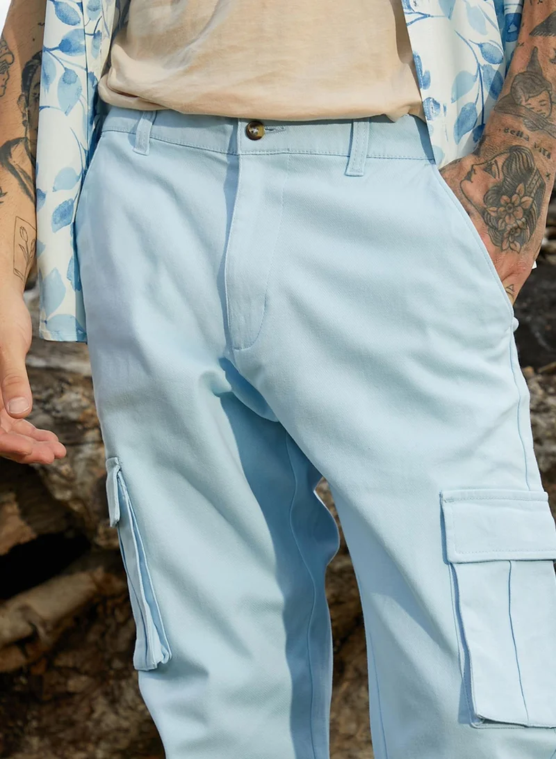 Campus Sutra Campus Sutra Men's Light Blue Cuffed Hem Cargo Trousers For Casual Wear | 6 Pockets | Regular Fit | Button Closure | Cotton Poly Cargo Pant Crafted With Comfort Fit For Everyday Wear