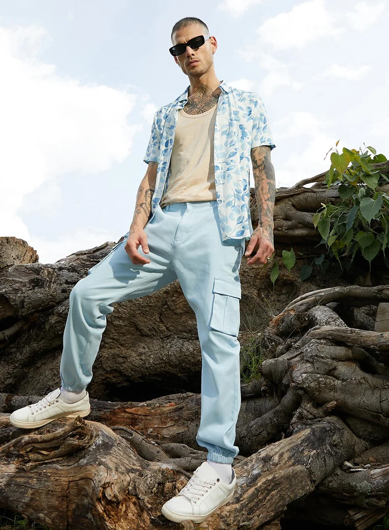 Campus Sutra Campus Sutra Men's Light Blue Cuffed Hem Cargo Trousers For Casual Wear | 6 Pockets | Regular Fit | Button Closure | Cotton Poly Cargo Pant Crafted With Comfort Fit For Everyday Wear