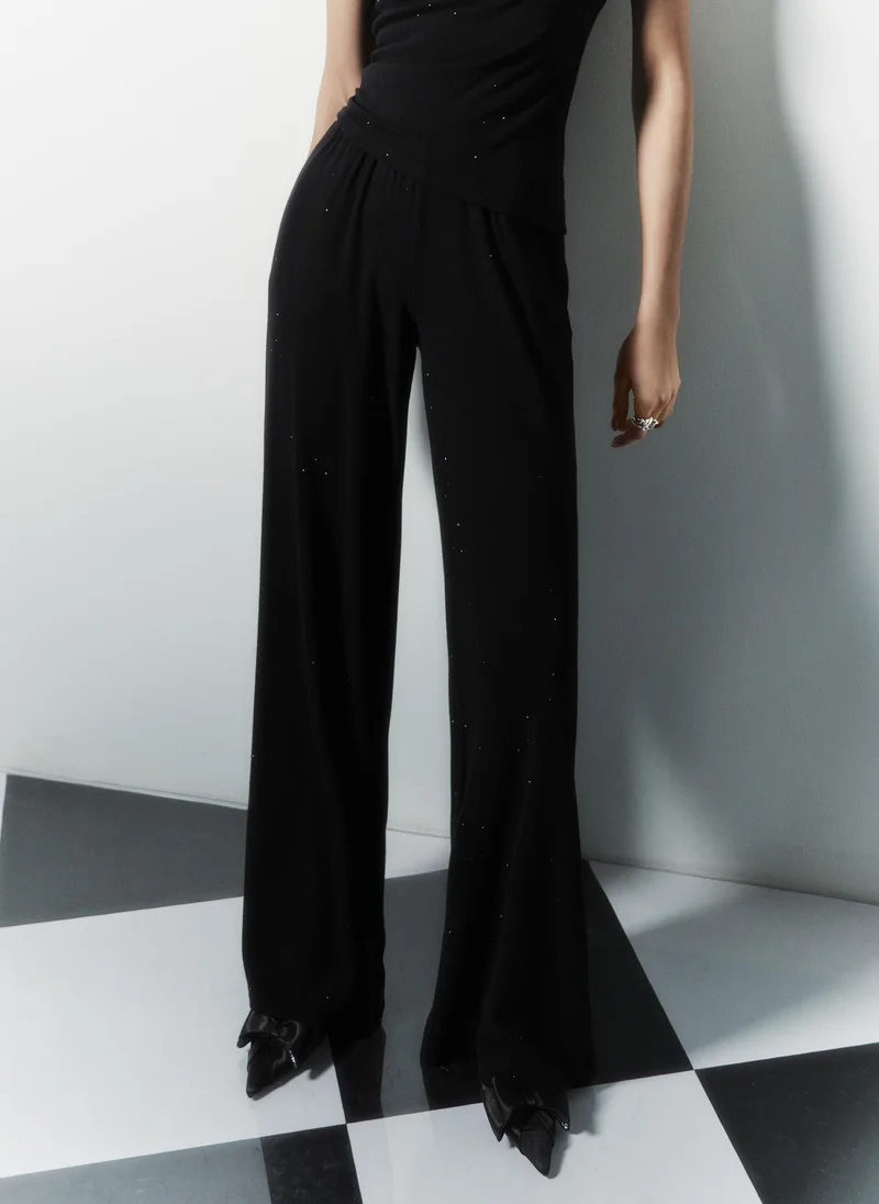 ليتشي بنطال جيرسي مرصع بأحجار الراين