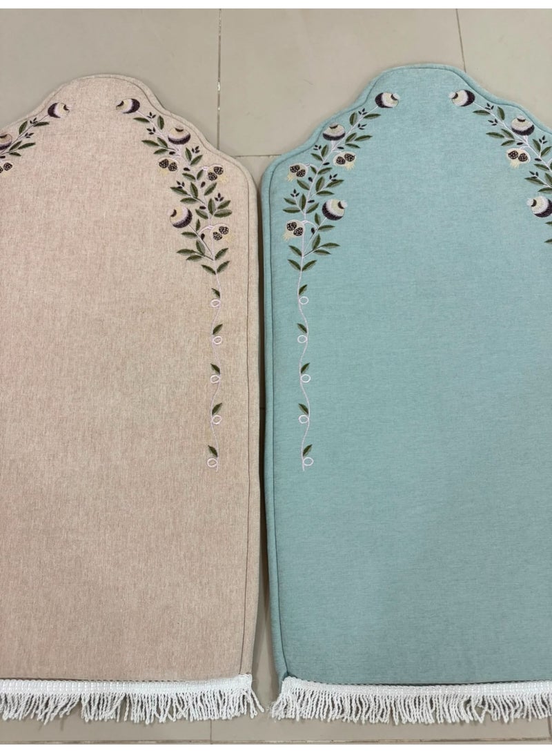 A two-piece prayer rug set in two different colors, featuring padding and embroidery with a classic, elegant *mihrab* design. - Image 1