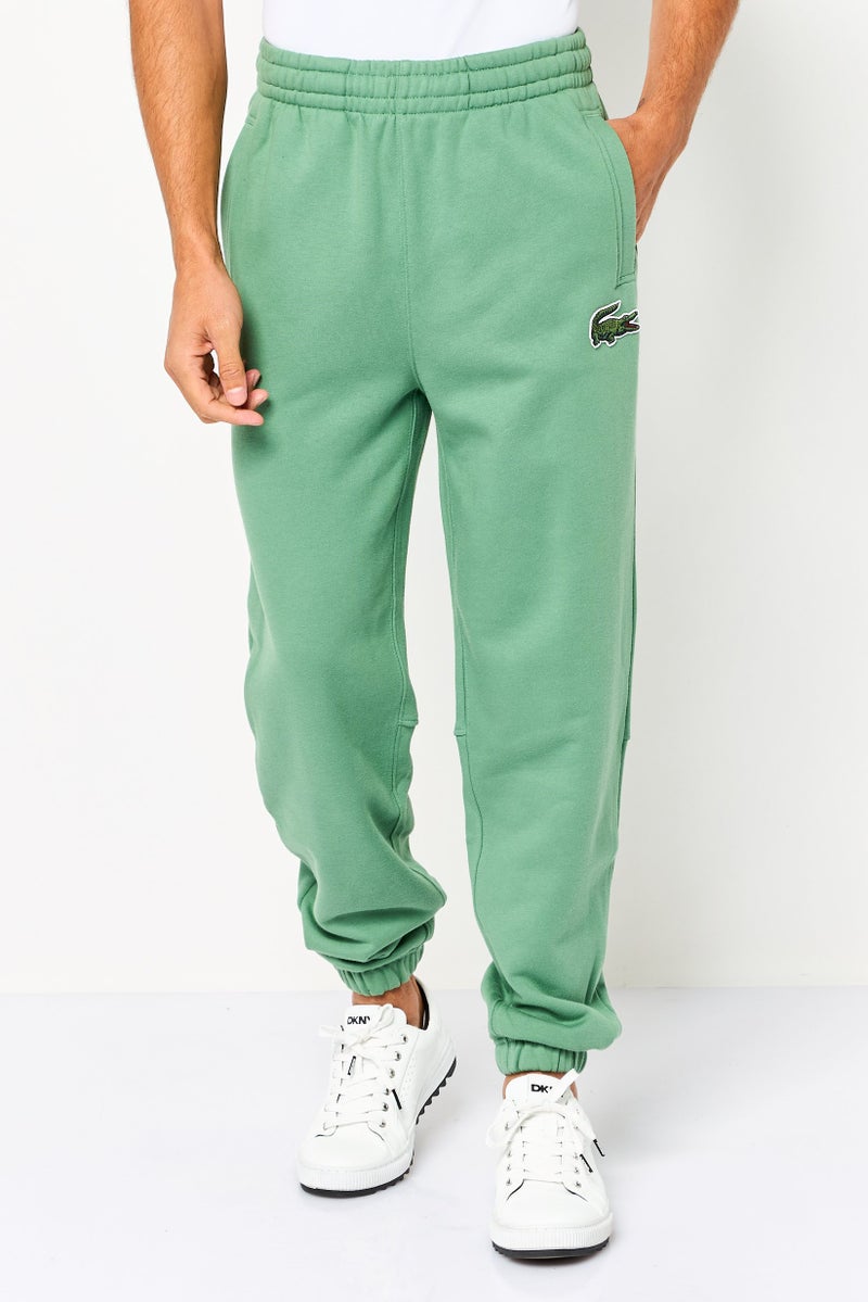 LACOSTE Men Relaxed Fit Embroidered Logo Sweatpants, Green - Image 1