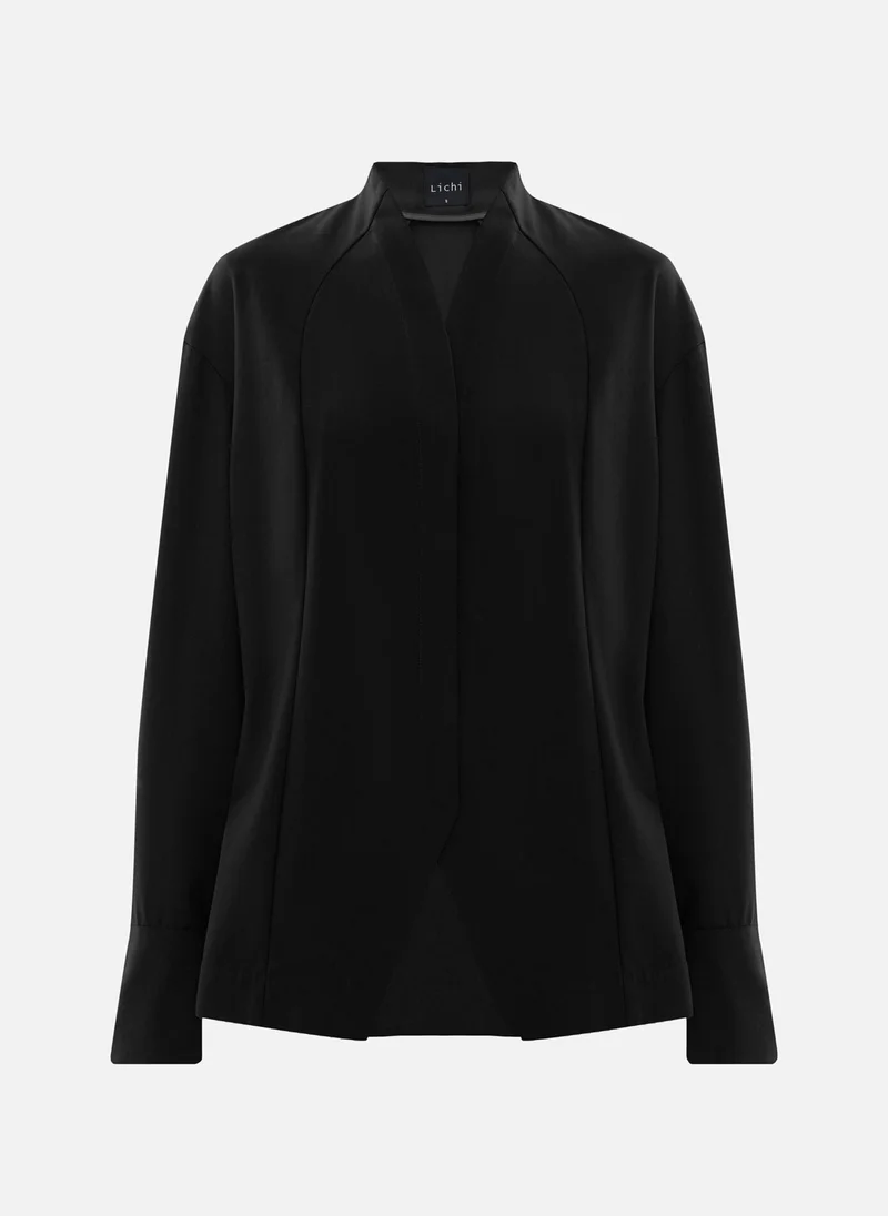 ليتشي قميص بقصّة معقدة مع أزرار مخفية
