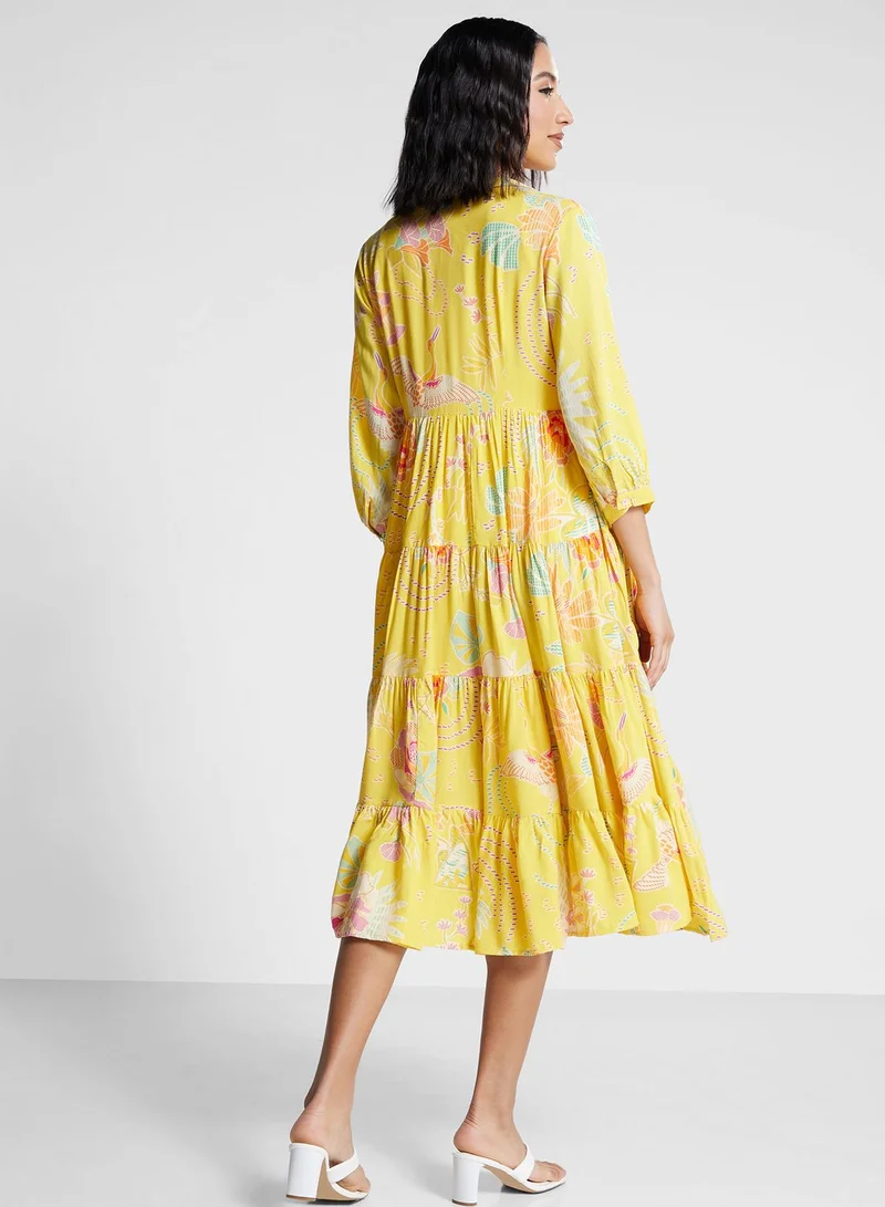 بيبا فستان متدرج مزين بطبعة زهور وبأزرار من الأعلى إلى الأسفل