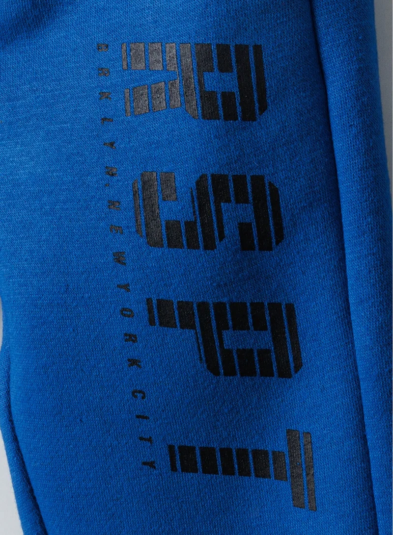 MINOTI Kids Boys Sweat Joggers with Side Print and Drawcord Waist