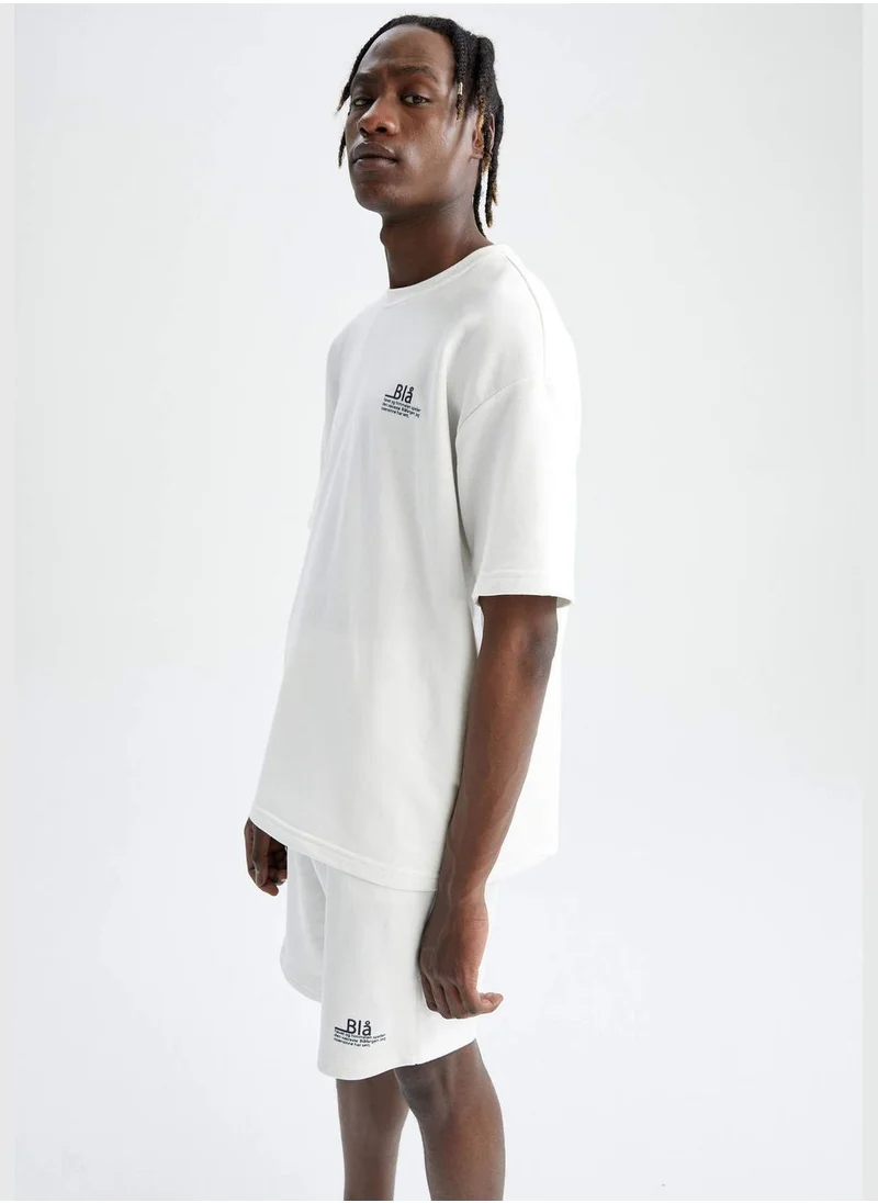 ديفاكتو Oversize Fit Short Sleeve Slogan Printed T-Shirt