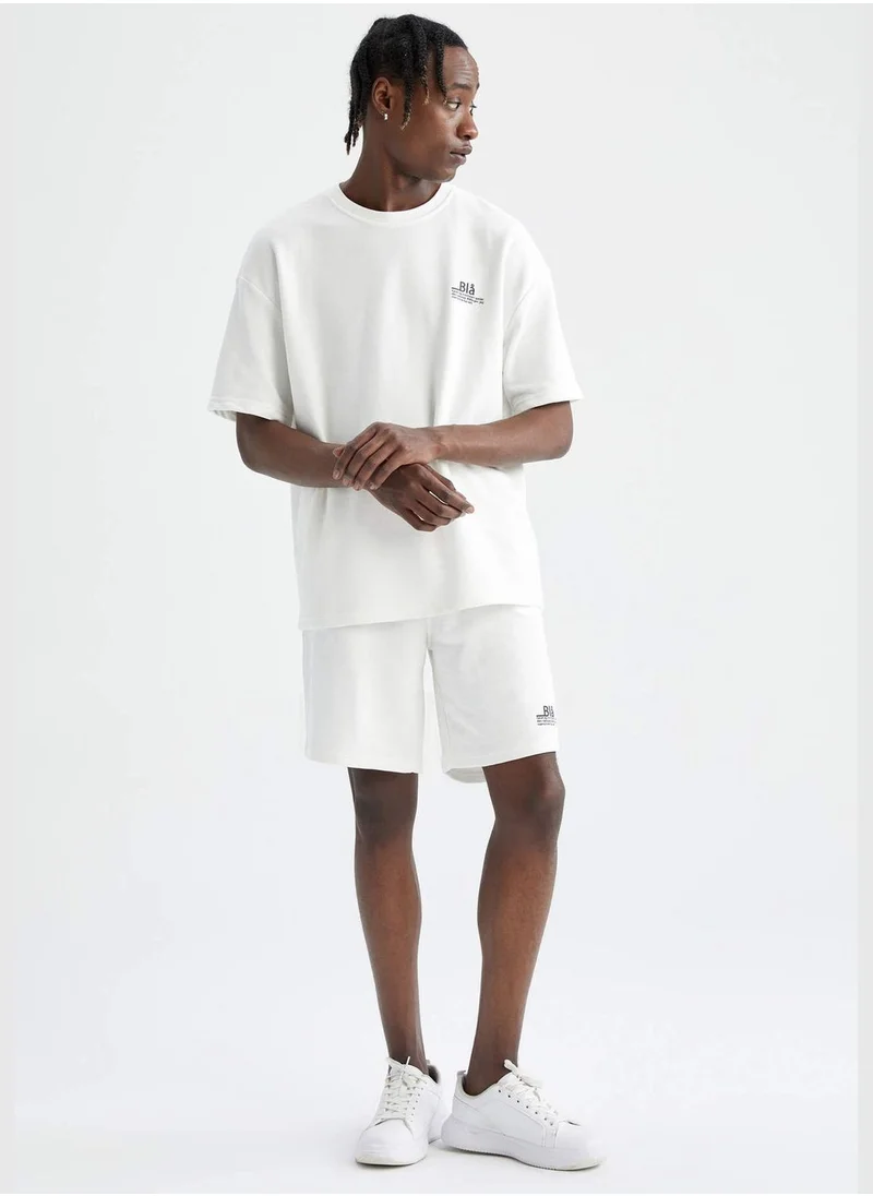 ديفاكتو Oversize Fit Short Sleeve Slogan Printed T-Shirt