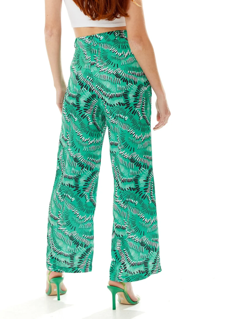 Liquorish Abstract Print Trousers in Green