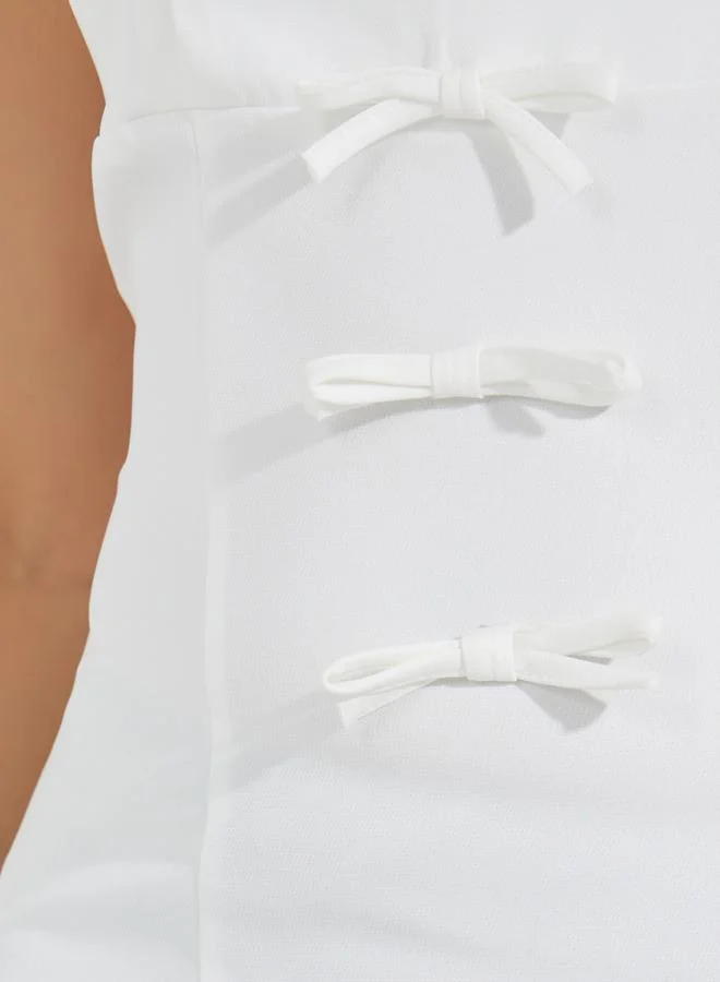 Styli Solid Sleeveless Top with Front Bow Detail