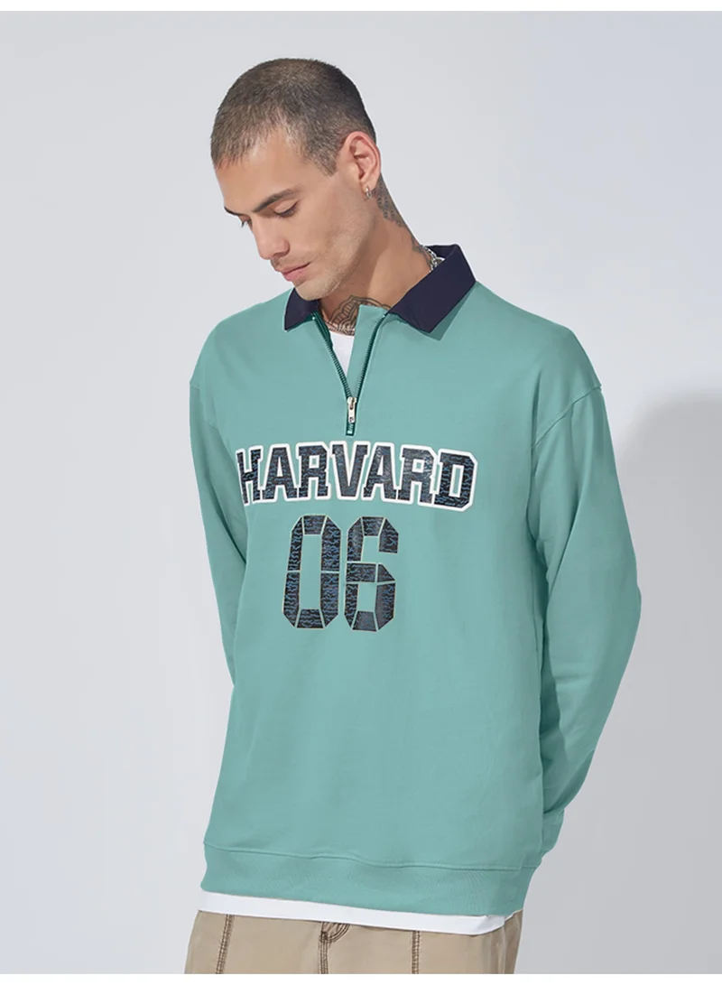 مانياك سويت شيرت قطن رجالي بياقة بولو وأكمام كاملة بسحاب نصفي بطبعة مانياك أخضر بيرلي