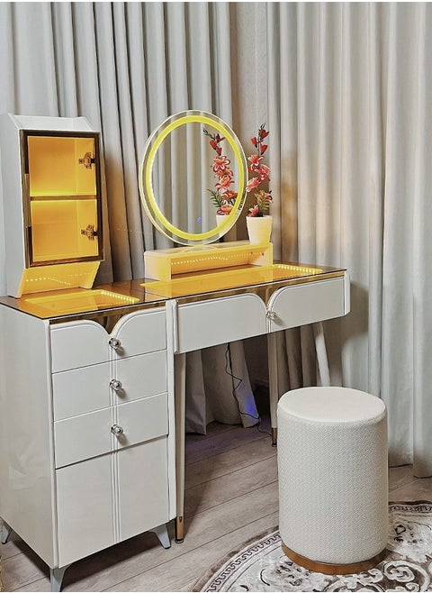 A dressing table with LED lighting and innovative storage compartments with an ergonomic chair