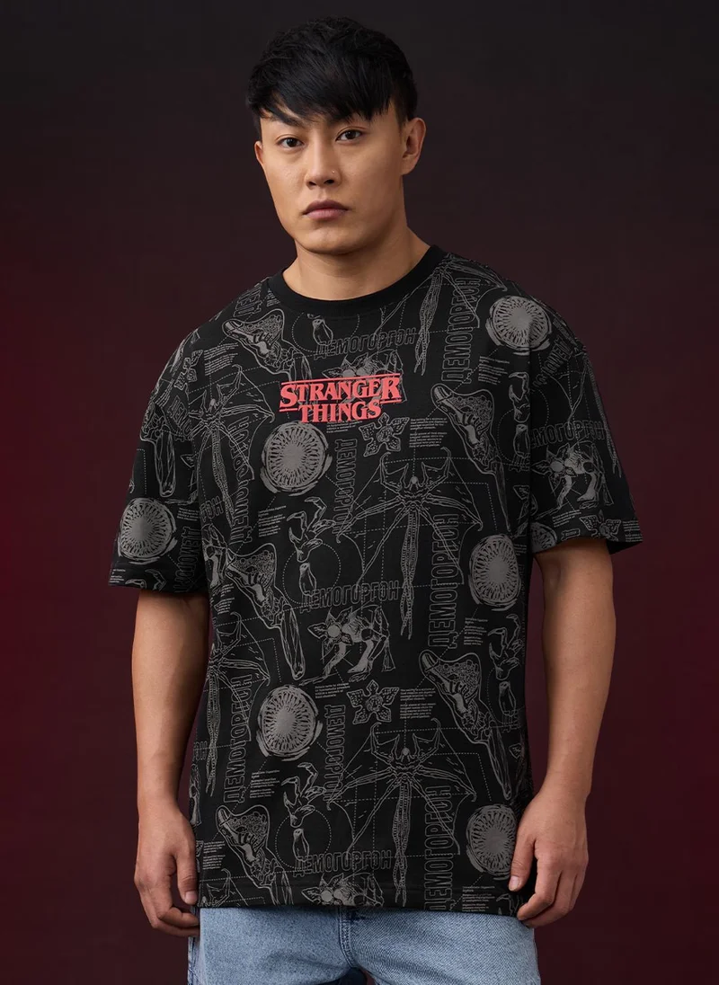 The Souled Store Stranger Things: Logo Men and Boys Short Sleeves Round Neck Black Graphic Printed Monster Graphic Oversized T-Shirt