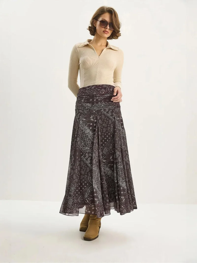 بيانكو لوتشي تنورة ميدي بخصر عالٍ وطبعة عرقية من لوكسي