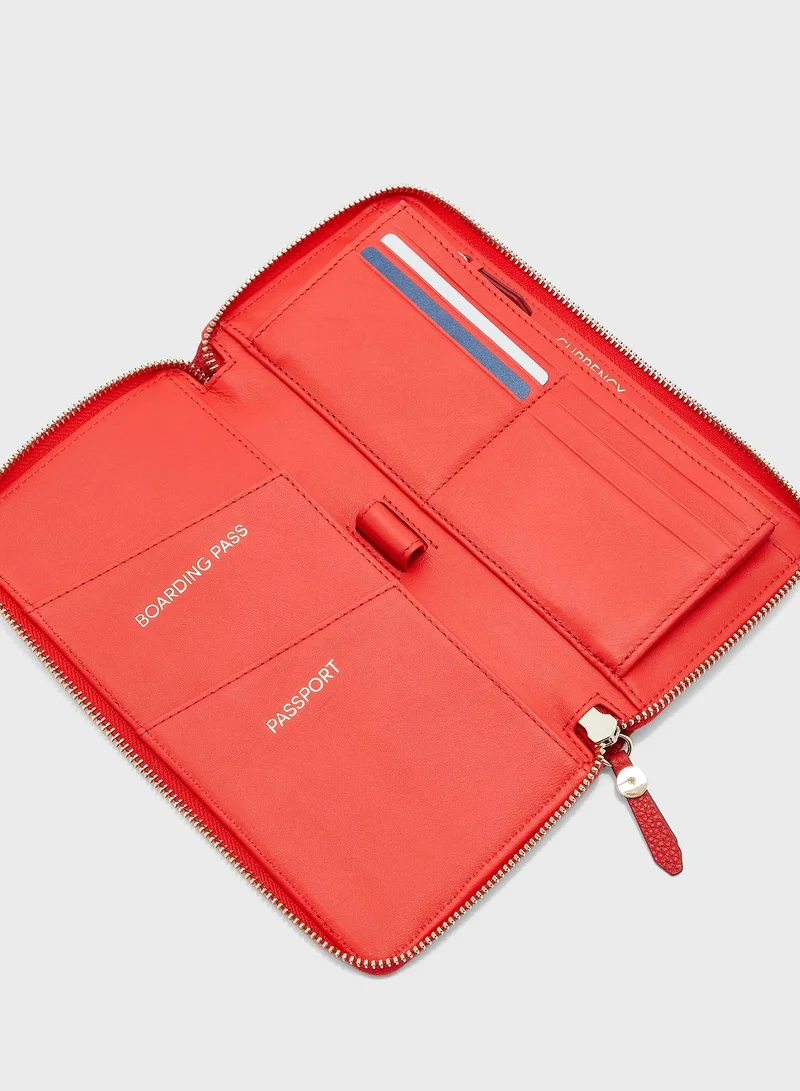 COLE HAAN Zip Through Clutch