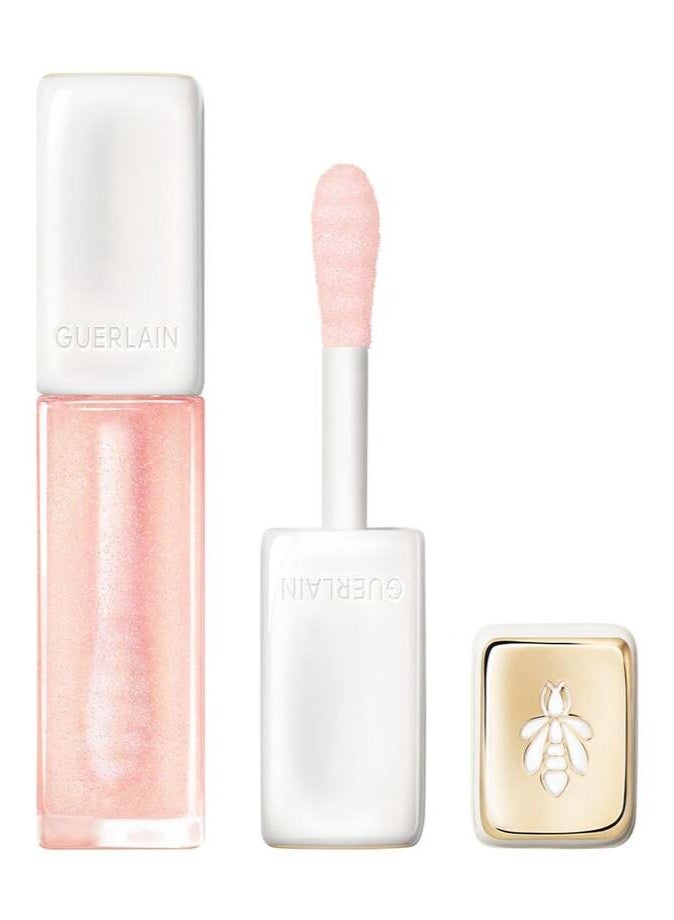 غيرلان KissKiss Bee Glow زيت ممتلئ للشفاه (9.5 مل) – درجة 100 Warm Glow: ملمع شفاه مرطب ومعزز لامتلاء الشفاه بتركيبة غنية بالعسل. - Image 1
