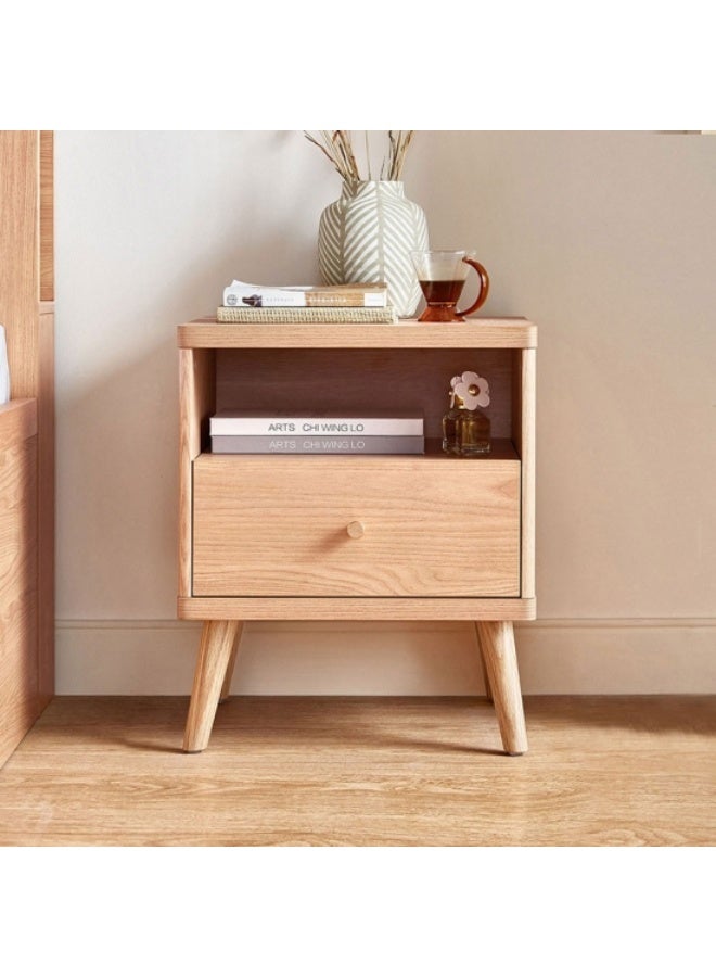 A bedside table, or nightstand, is an essential piece of furniture that often goes unnoticed but plays a vital role in our daily routines. It offers both functionality and style, helping to complete the look of your bedroom. Welcome to explore the new style. - Image 1