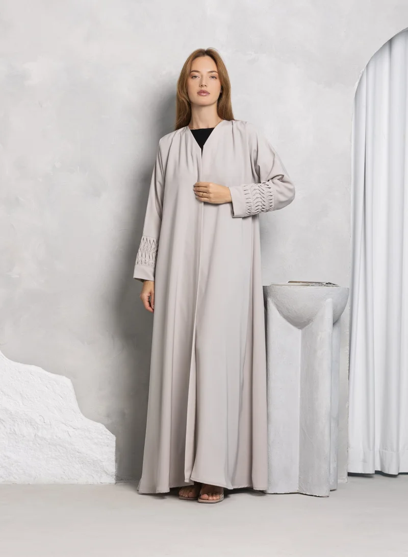 Nikias Light grey soft crepe fabric with designs on cuffs