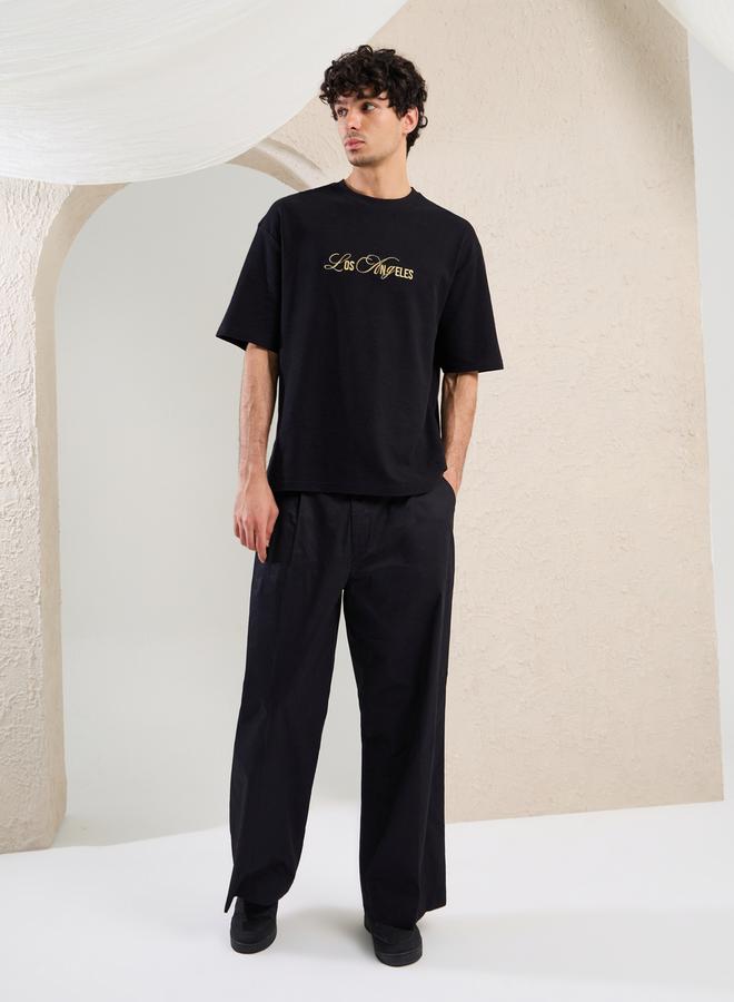 ستايلي تيشيرت أوفر سايز مطرز بشعار - Image 2