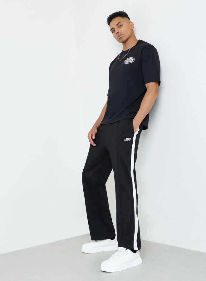 ستايلي Men Black Oversized Side Stripe Tape Detail Terry Joggers