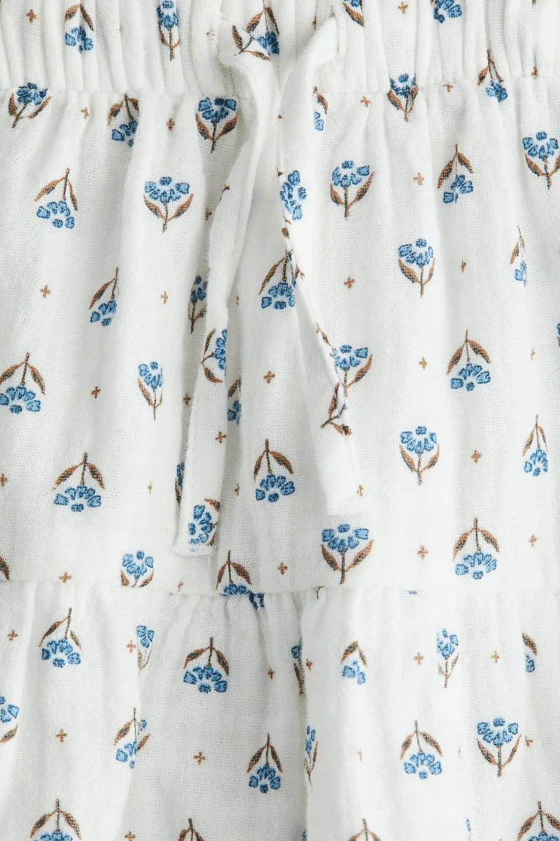 اتش اند ام تنورة من الموسلين مزيّنة بطبعة