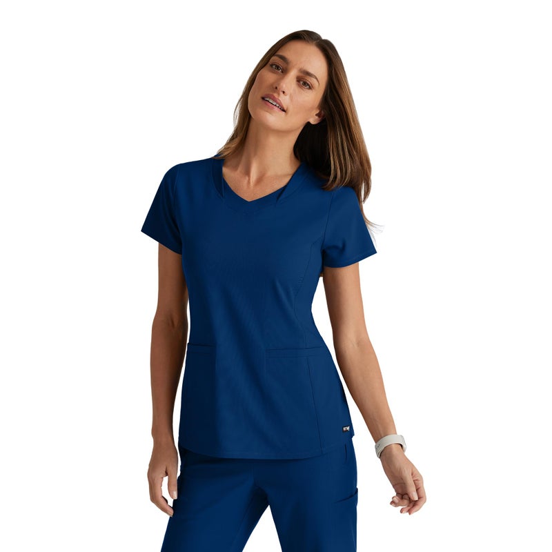 BARCO Greyâ€™s Anatomy Spandex Stretch Direct Bolt Scrub Top for Women â€“ Indigo, 3-Pocket V-Neck Shirt w/Spandex Stretch, Wrinkle Release & Soil Release Fabric â€“ Medium, Regular Fit - Image 1