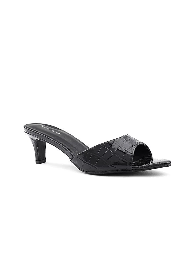 أيقون Glamorous heel slipper with a shimmering surface.