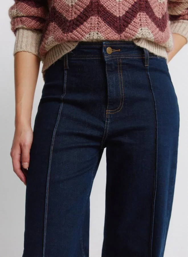 Springfield  High-waisted jeans with back patch pockets, button and zip fastening fastening , front seams, and a wide, straight leg. These jeans feature a washing process using new technologies, reducing water, chemical, and energy consumption. for Women | Best Price UAE