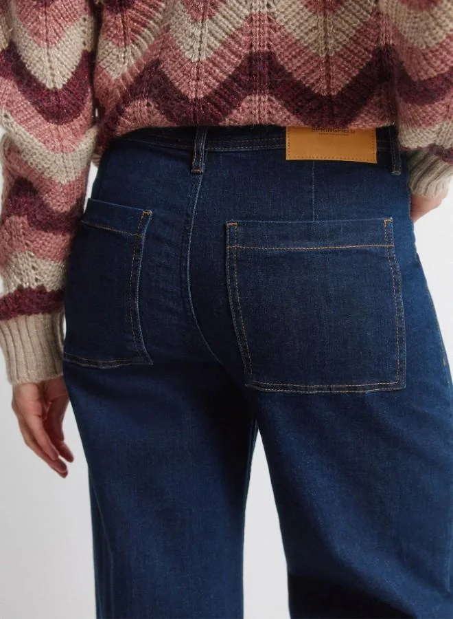 Springfield  High-waisted jeans with back patch pockets, button and zip fastening fastening , front seams, and a wide, straight leg. These jeans feature a washing process using new technologies, reducing water, chemical, and energy consumption. for Women | Best Price UAE