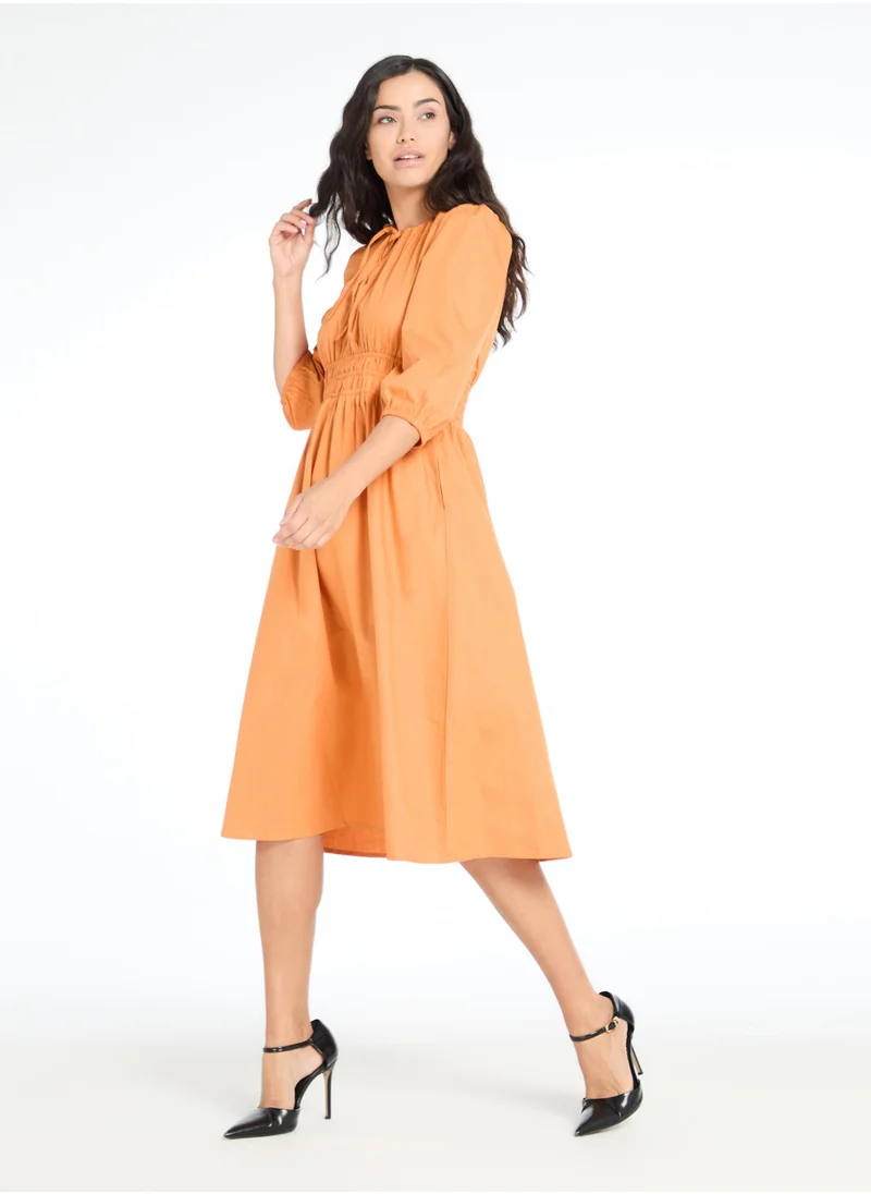 The Label Life Caramel Smocked Midi Dress