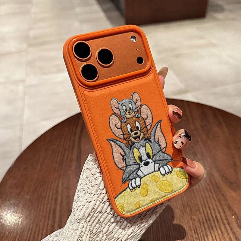 Apple iPhone 17 Pro Max phone case with cute orange cartoon design featuring a mouse and cat for drop protection