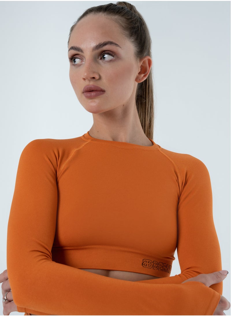 Bernessi Turkiye Nylon Long Sleeve Crop Top with Round Neck Women's Cropped T Shirt for Workout Yoga Running Exercise Textured Orange Amber  - Image 1