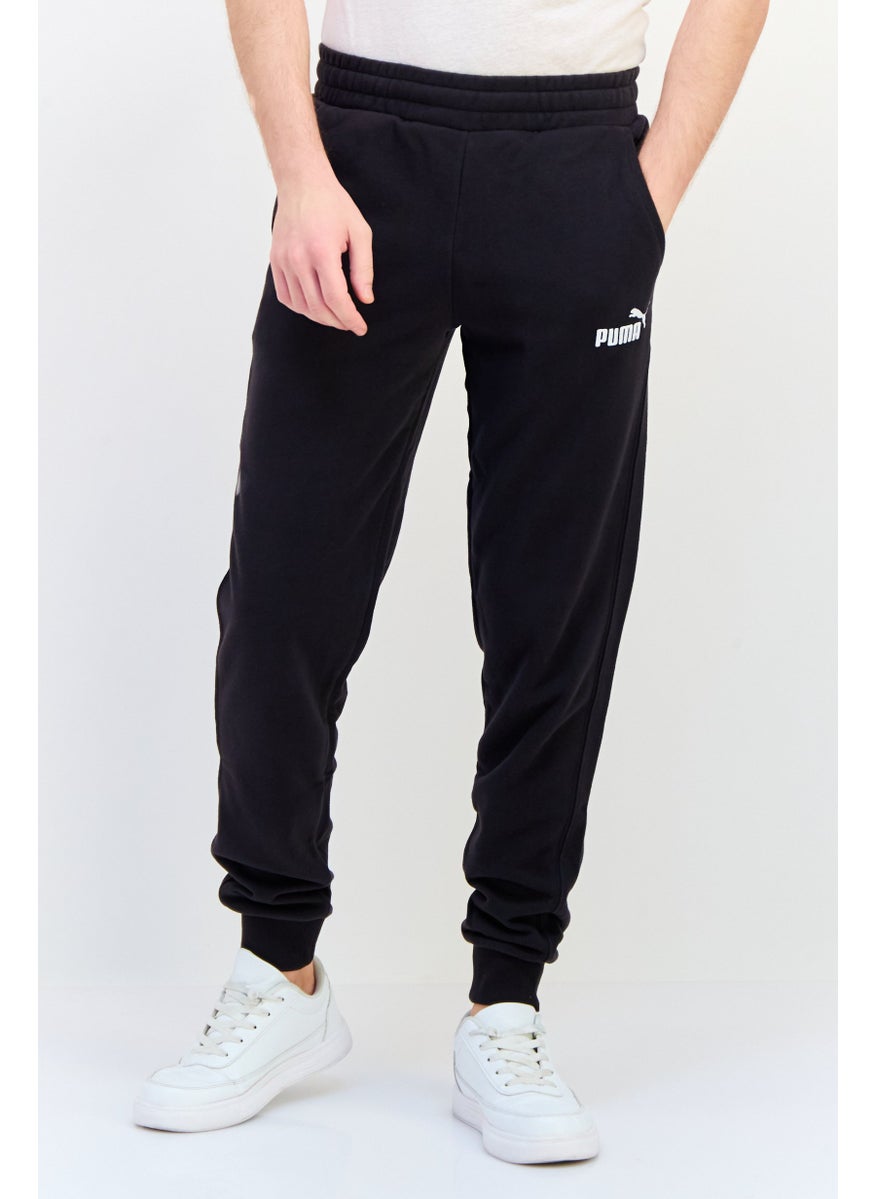 PUMA Men Sportswear Fit Outdoor Sweatpants, Black  - Image 1
