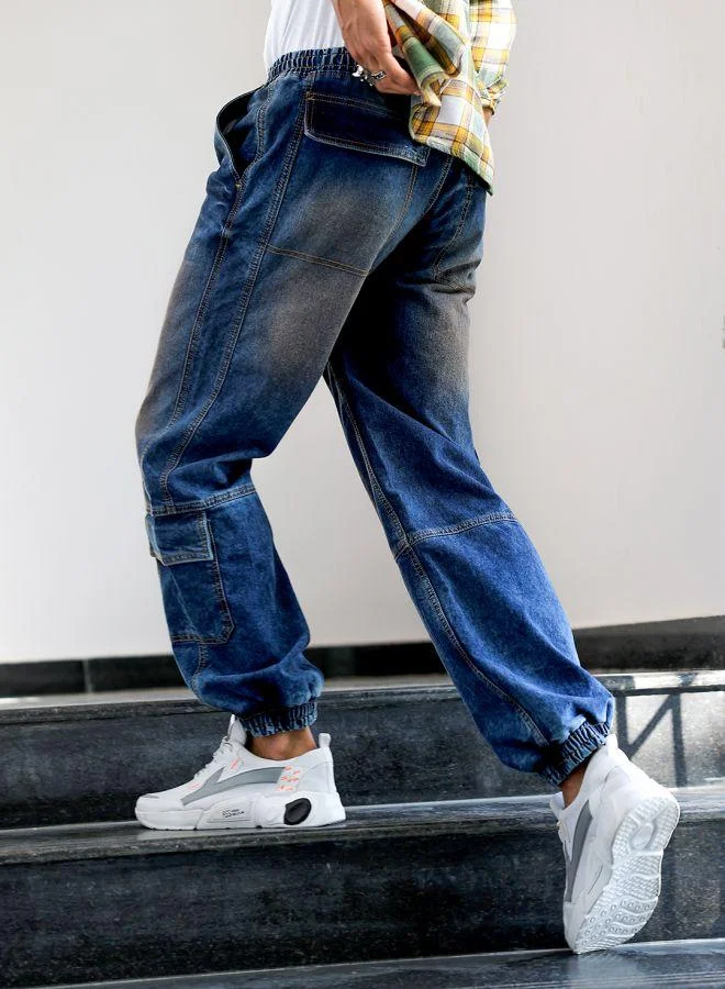ذا انديان كراج كو Men Loose Fit Solid Mid-Rise Stretchable Denim Joggers
