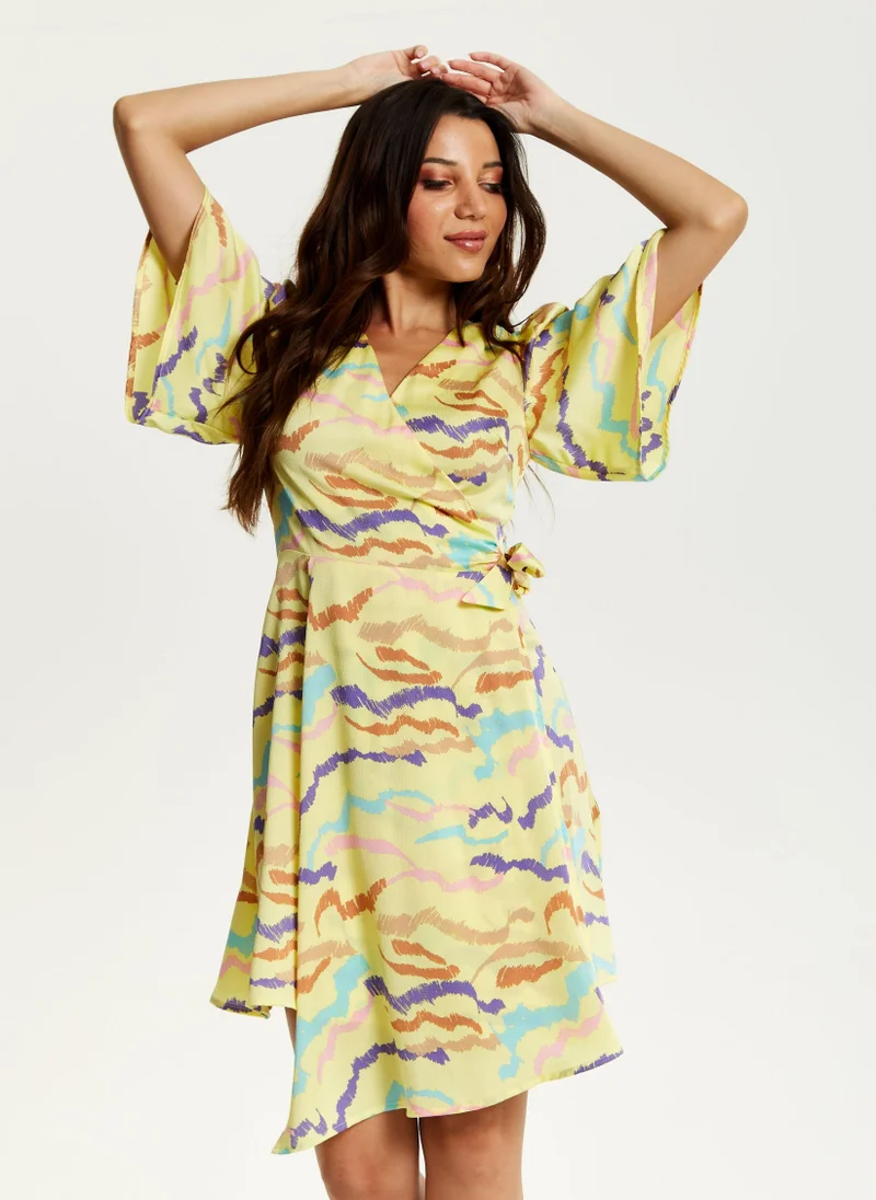 Liquorish Mini Abstract Print Wrap Dress In Yellow