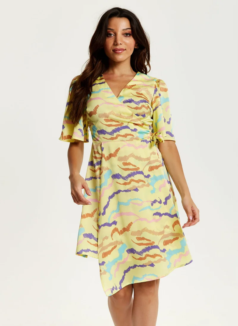 Liquorish Mini Abstract Print Wrap Dress In Yellow