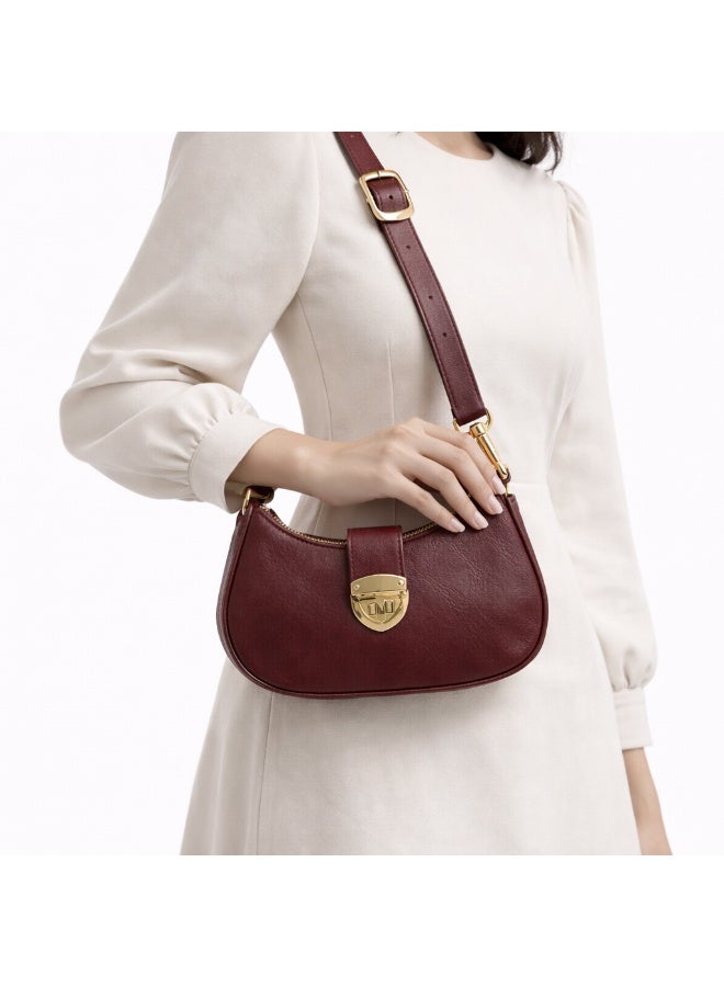 A stylish women's shoulder bag with a design that combines elegance and practicality, featuring a distinctive gold clasp and an adjustable strap. - Image 1