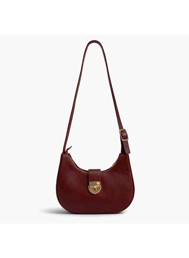 A stylish women's shoulder bag with a design that combines elegance and practicality, featuring a distinctive gold clasp and an adjustable strap. - Image 4