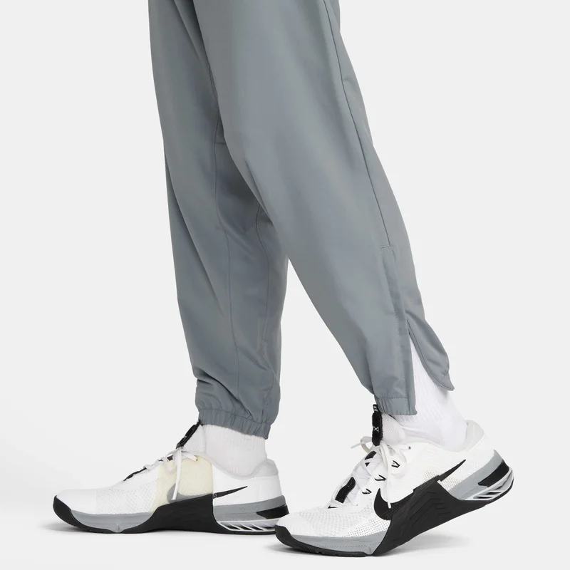 Nike grey Men's Dri-FIT Tapered Pants for Men | Best Price UAE
