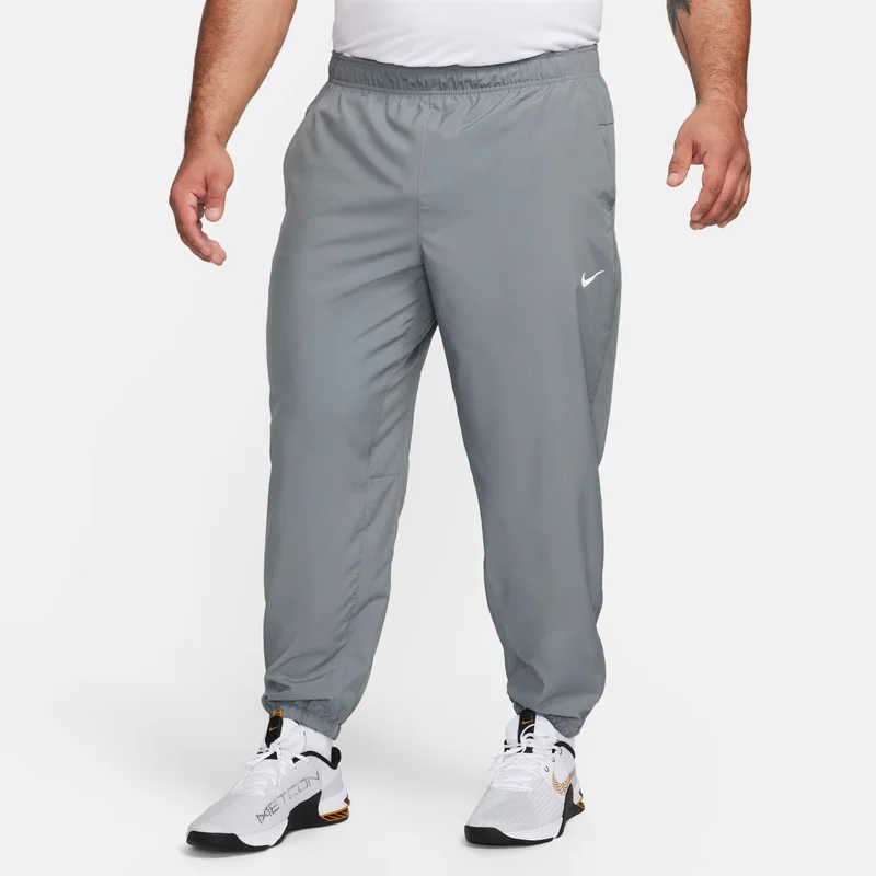 Nike grey Men's Dri-FIT Tapered Pants for Men | Best Price UAE