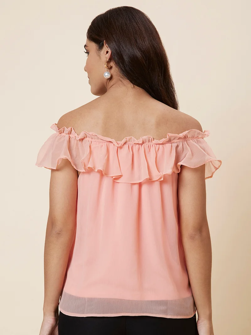 جلو باص بلوزة نسائية سادة من البوليستر بلون الخوخي