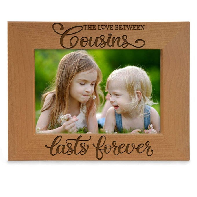 THE LOVE BETWEEN COUSINS LASTS FOREVER ENGRAVED NATURAL WOOD PICTURE FRAME 4X6HORIZONTAL